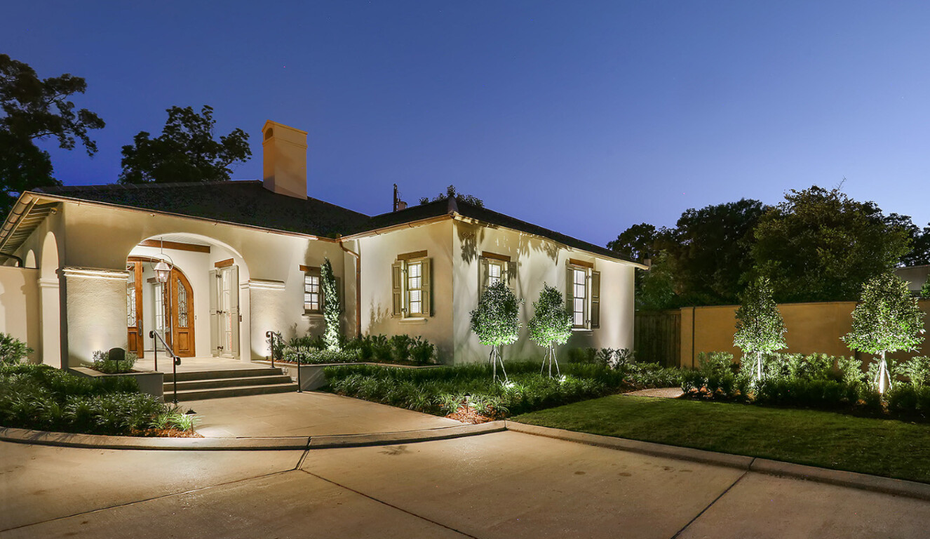 Professionally finished concrete driveway at dusk in residential area